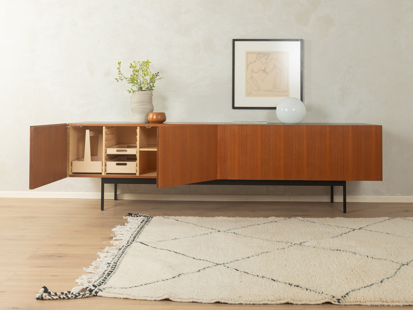 B40 Sideboard by Dieter Wäckerlin with teak veneer, black Resopal top, four doors, and steel legs